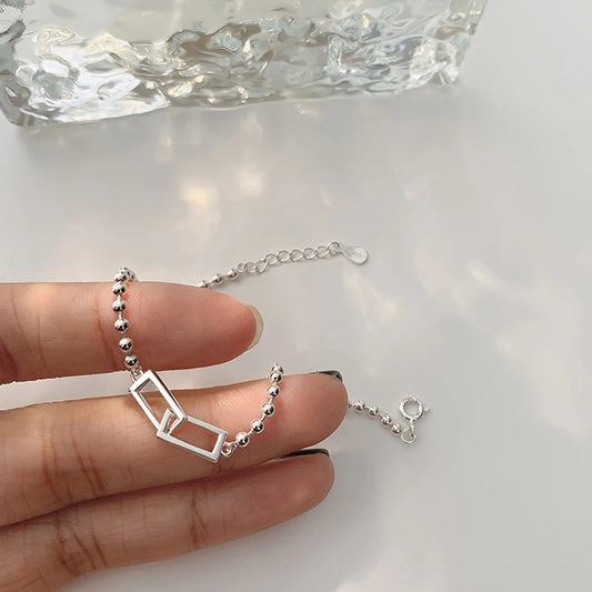 Cadenas con Alma: Pulsera en Plata con Eslabones de Patrones Variados