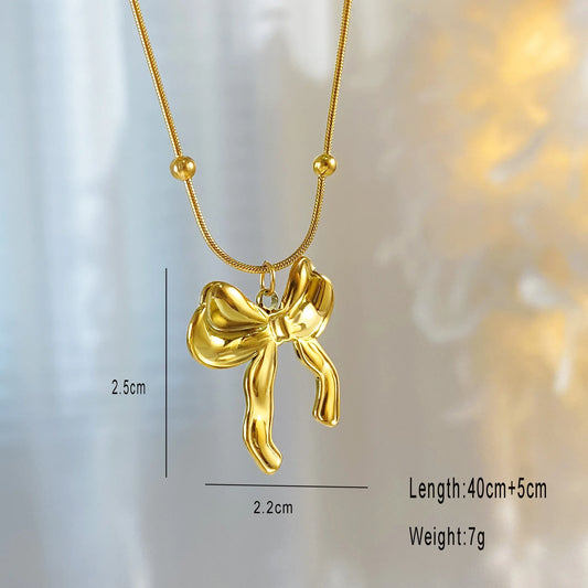 Lazo Dorado: Collar con Colgante en Forma de Moño