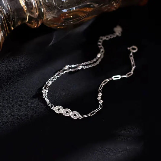 Cadenas con Alma: Pulsera en Plata con Eslabones de Patrones Variados
