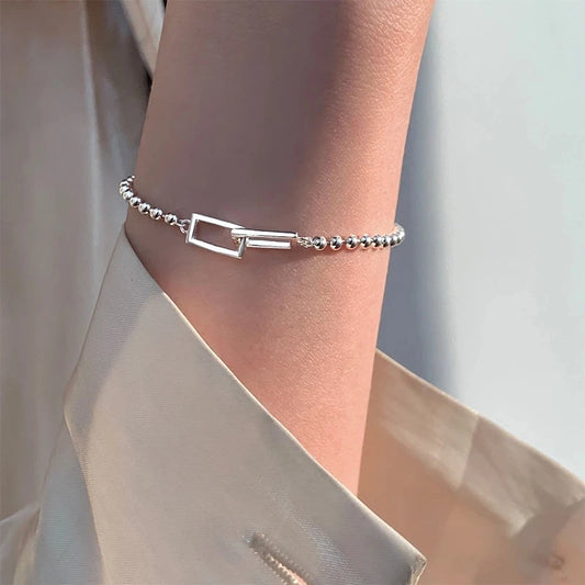 Cadenas con Alma: Pulsera en Plata con Eslabones de Patrones Variados