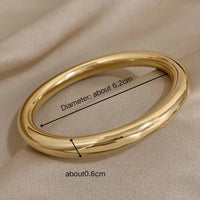 Círculo Perfecto: Bangle en Plata u Oro de Estilo Atemporal