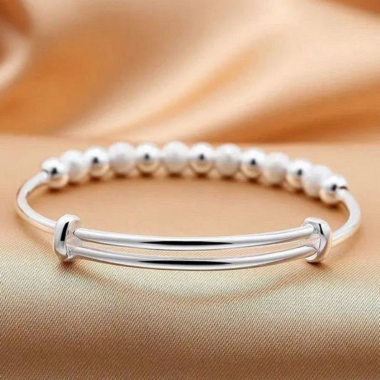 Equilibrio Brillante: Pulsera Bangle Ajustable en Plata con Esferas Alternas Mate y Pulidas
